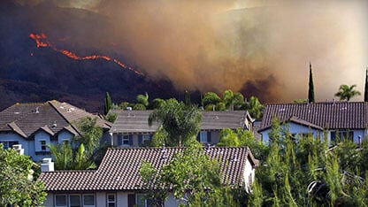 Fire season in Southern California is now year-round due to the recurring droughts and warming climate. Fire fighters from all around come to battle this blaze.