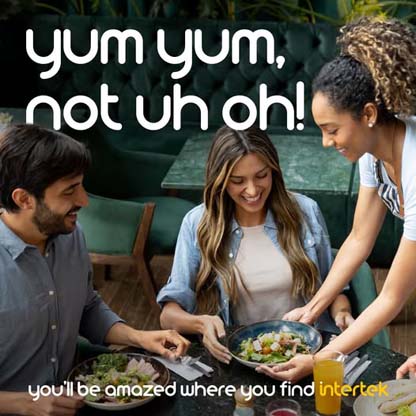 Smiling couple being served food at a restaurant