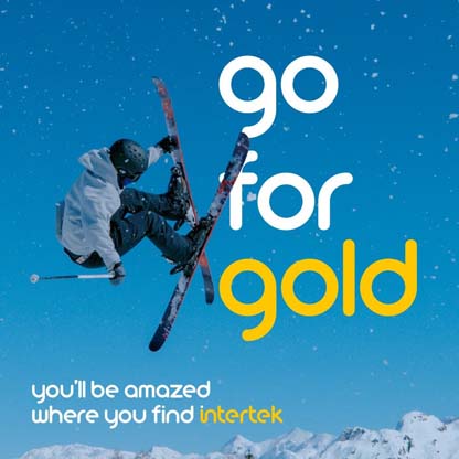 A snow skier caught at the height of their jump