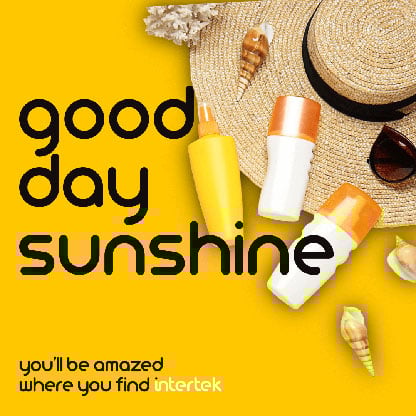 Outdoor skin care products next to a sun hat